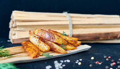 Rustic baked potatoes on wooden boards