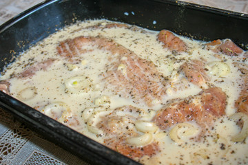 Closeup of red meat marinated. Covering Back ribs in marinade.