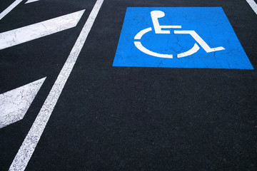 Wheelchair symbol, International Symbol of Access - sign of a person in a wheelchair on a blue...