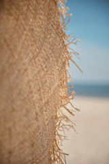 Close up of straw hat on the beach