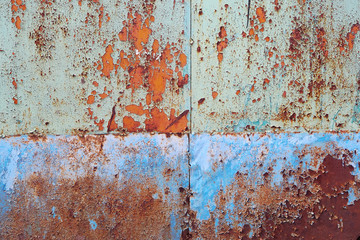 rusty metal surface with traces of peeling paint