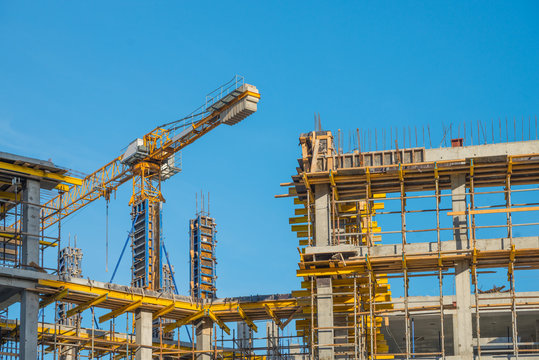 Construction crane near new built house. Construction and developing horizontal photo