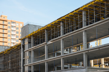Scaffolding system on the construction new building. Development and real estate