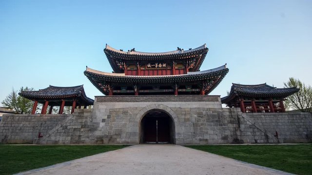 Jeonju, South Korea - May 2015 : Timelapse shot of  Ancient castle Pungnammun Gate in Jeonju Korea. Korean Treasure No. 308, Built in 1767. Chinese characters is Pungnammun gate.