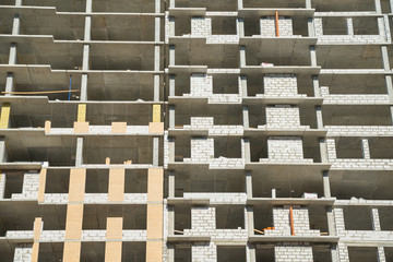 Floors of the unfinished building. Incomplete construction of multistory building