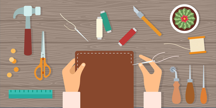 Man's hands sew a leather notebook cover and tools around on a table vector icon flat isolated