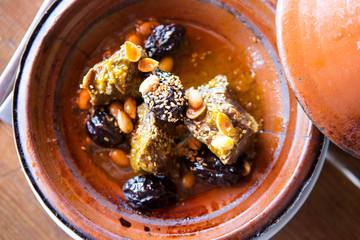 Beef tagine with prunes, almonds and sesame seeds 