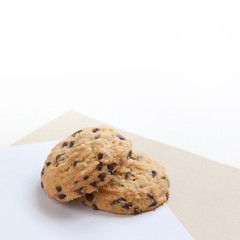 Sweet tasty cookies with chocolate chips on the table