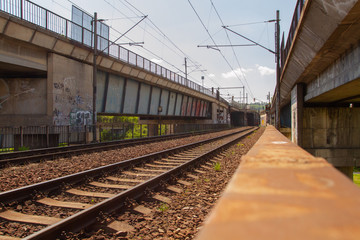 Obraz premium old railway bridge for trains in the Czech city and tracks next to it