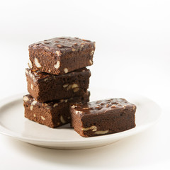A stack of chocolate brownies on white background, Homemade bakery and dessert.
