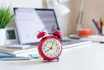 Business concepts with red clock  on desk.For investment analysis,waiting to sucess ideas .time and working