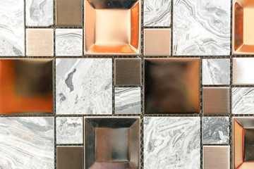 Naklejka premium Ceramic mosaic tiles with white and brown embossed squares to decorate the kitchen, bathroom or pool. Mosaic of brown marble in the form of squares