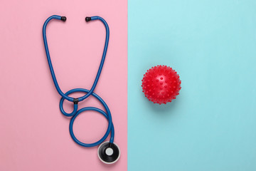 Fototapeta premium Diagnosis of coronavirus, pneumonia. Stethoscope with a strain of virus on pink blue background