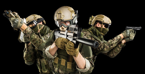 Male in uniform of Tactical Units of Police with submachine gun P90. Shot in studio. Isolated with...