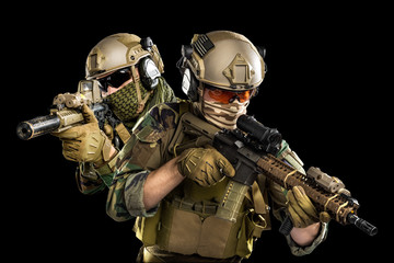 Naklejka premium Male in uniform of Tactical Units of Police with submachine gun P90. Shot in studio. Isolated with clipping path on black background