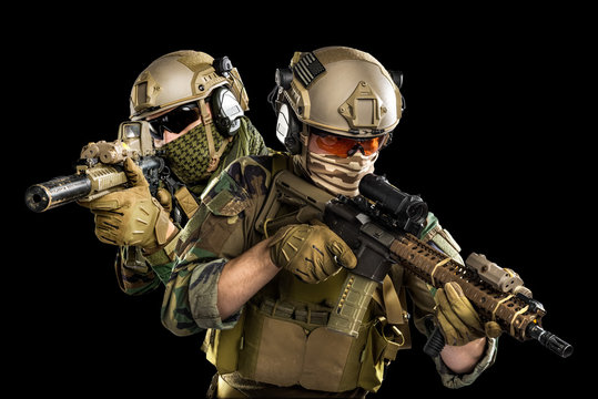 Male in uniform of Tactical Units of Police with submachine gun P90. Shot in studio. Isolated with clipping path on black background
