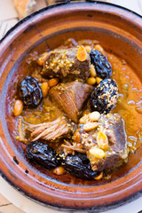 Beef tagine with prunes, almonds and sesame seeds 