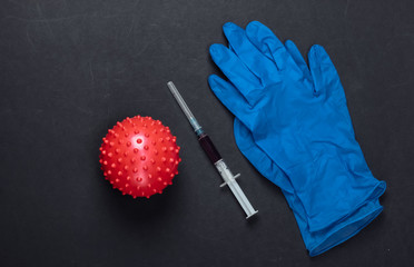 Coronavirus treatment. Virus strain and syringe, gloves on black background. Vaccination. Medical...
