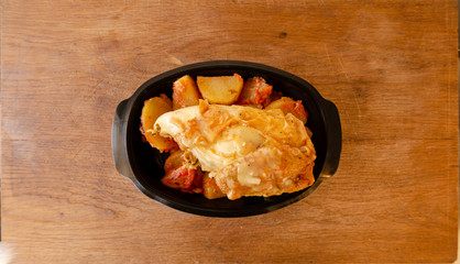 chicken with potatoes in plastic container for take away delivery
