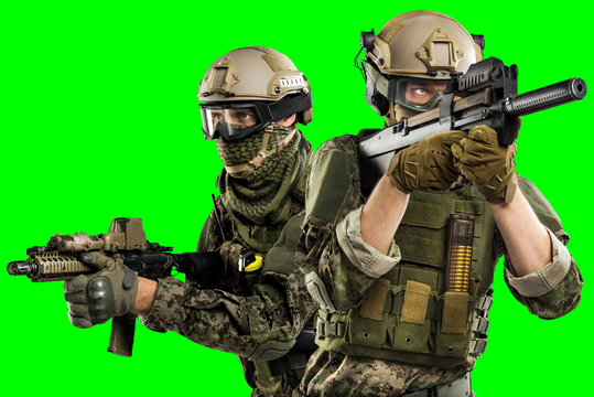 Male in uniform of Tactical Units of Police with submachine gun P90. Shot in studio. Isolated with clipping path on green chroma key background