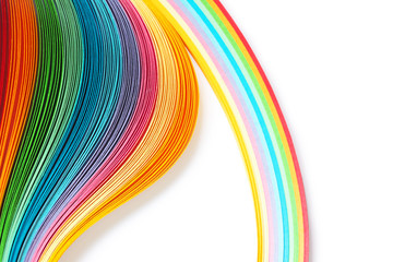 Strips of paper for quilling on white background, rainbow color