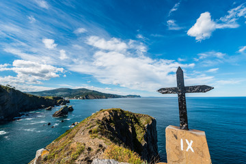 One of the crosses on the Way of the Cross going up to the Gaztelugatxe Hermitage in Cape Matxitxako