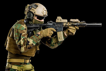 US marine corps soldier with rifle. Shot in studio. isolated with clipping on black background.