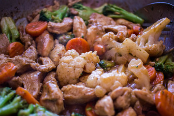 stir fried chicken, cauliflower, broccoli and carrots.