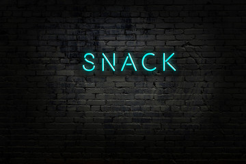Night view of neon sign on brick wall © iushakovsky