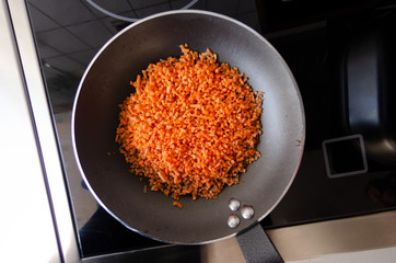 chopped carrot in a baking pan top view close up