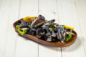 Appetizing stewed mussels in sauce 