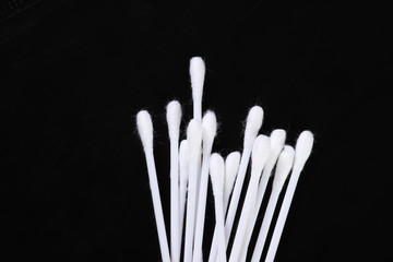 Ear cotton buds on a black background. Ear Care