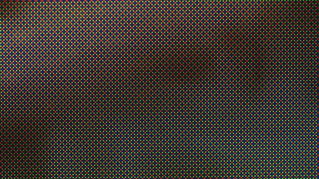 Super macro of lcd tv amoled screen matrix with colorful red, green and blue pixels. Extreme close-up. Digital technology.