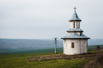 Fototapeta na wymiar Isolated orthodox chapel in the countryside in Romania