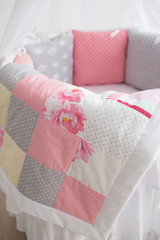 pink blanket and pillows in the bed