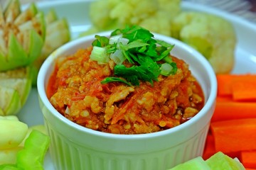 Thai northern style pork and tomato chili paste (Nam Prik Ong) served with assorted of fresh seasonal vegetables.