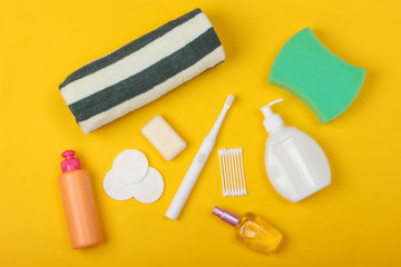 Beauty, health care, cosmetics, hygiene product on yellow background. Flat lay. Top view