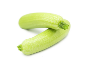 Fresh organic green zucchini isolated on a white background