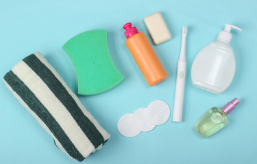 Beauty, health care, cosmetics, hygiene product on blue background. Flat lay. Top view