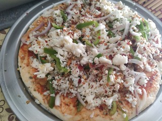 Close up of pizza before baking