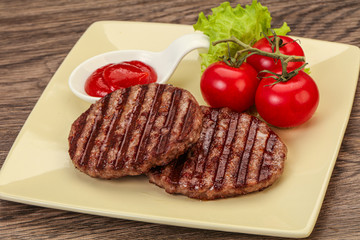 Grilled burger cutlet with sauce