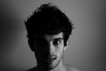 Black and white Man looking camera curly hair cute affraid