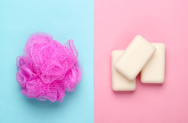 Bath, beauty products on a pink blue background. Sponge and soap. Top view. Flat lay