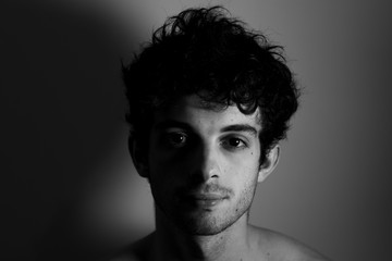 Black and white Man looking camera curly hair cute affraid