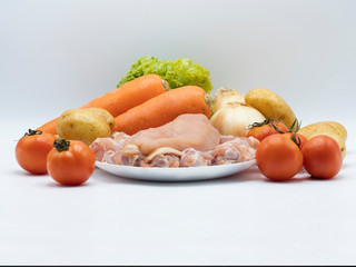 Ingredient for chicken soup on white background focus at center. Chicken soup is light meal for diet and easy to cook at home.