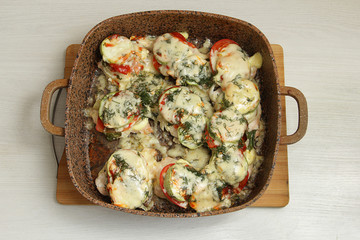 baked zucchini with vegetables in a frying pan, for proper nutrition