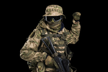 Fototapeta premium Special forces soldier with rifle. Shot in studio. Isolated with clipping path on black background.