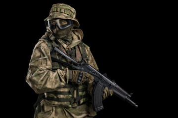 Fototapeta premium Special forces soldier with rifle. Shot in studio. Isolated with clipping path on black background.