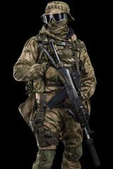 Special forces soldier with rifle. Shot in studio. Isolated with clipping path on black background.