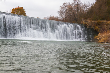 The Root River Drops Over Root River Falls and the Historic Dam in Laneboro, Minnisota, USA
